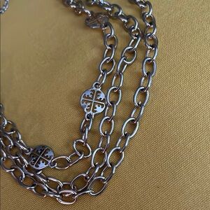 Two-Tone Silver and Gold Tone Triple Chain Necklace with Circular Emblem Detail